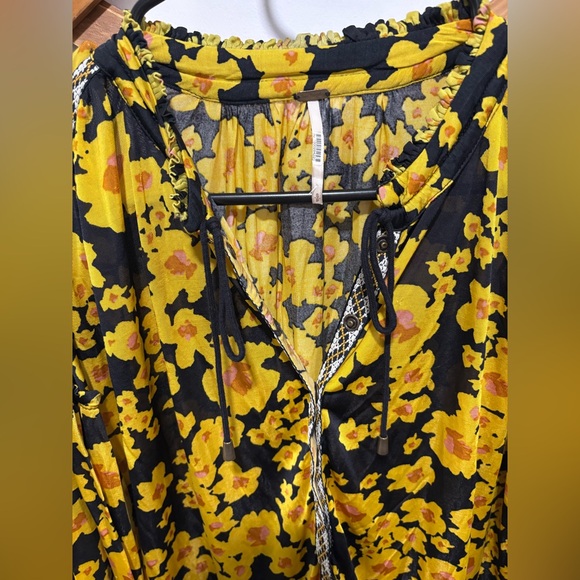 Free People Love Letter Floral Tunic Blouse in a black and yellow floral print. - Picture 5 of 11